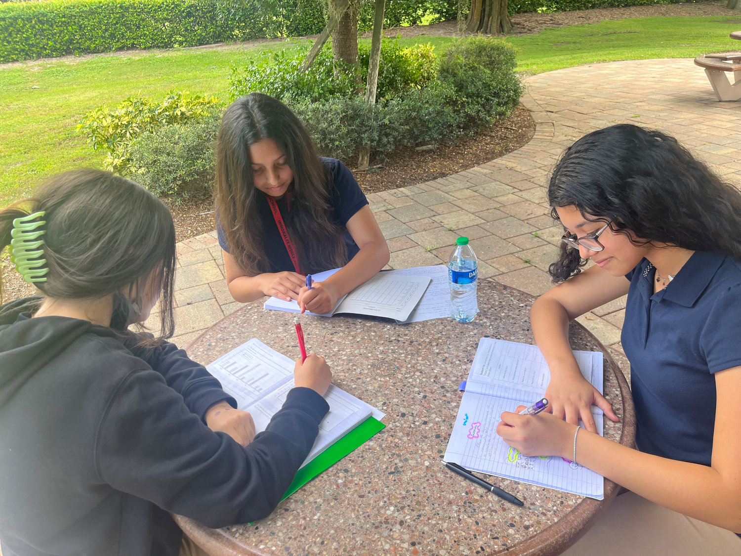 Immokalee Foundation middle school students Carol, Marcella and Angela learn to support each other on their educational journeys.